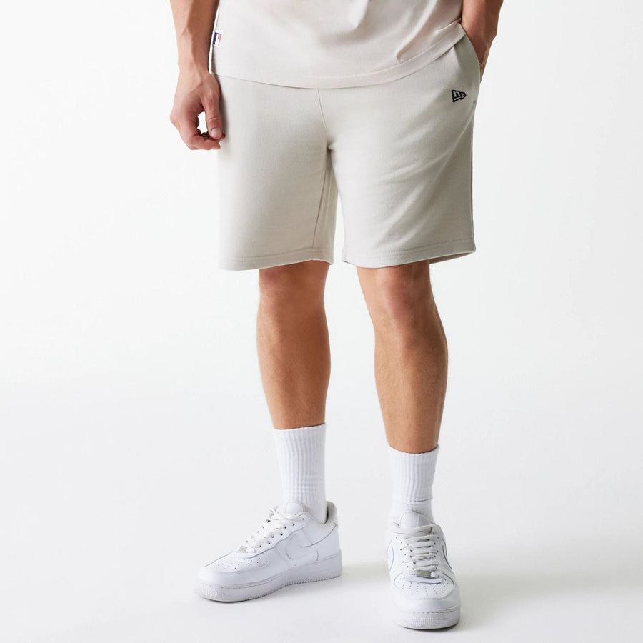 The Male model is wearing New York Yankees MLB League Essential Cream Shorts 1