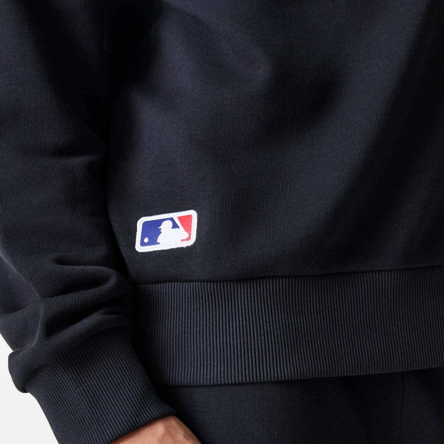 The Male model is wearing New York Yankees MLB League Essential Black Crew Neck Sweater 6