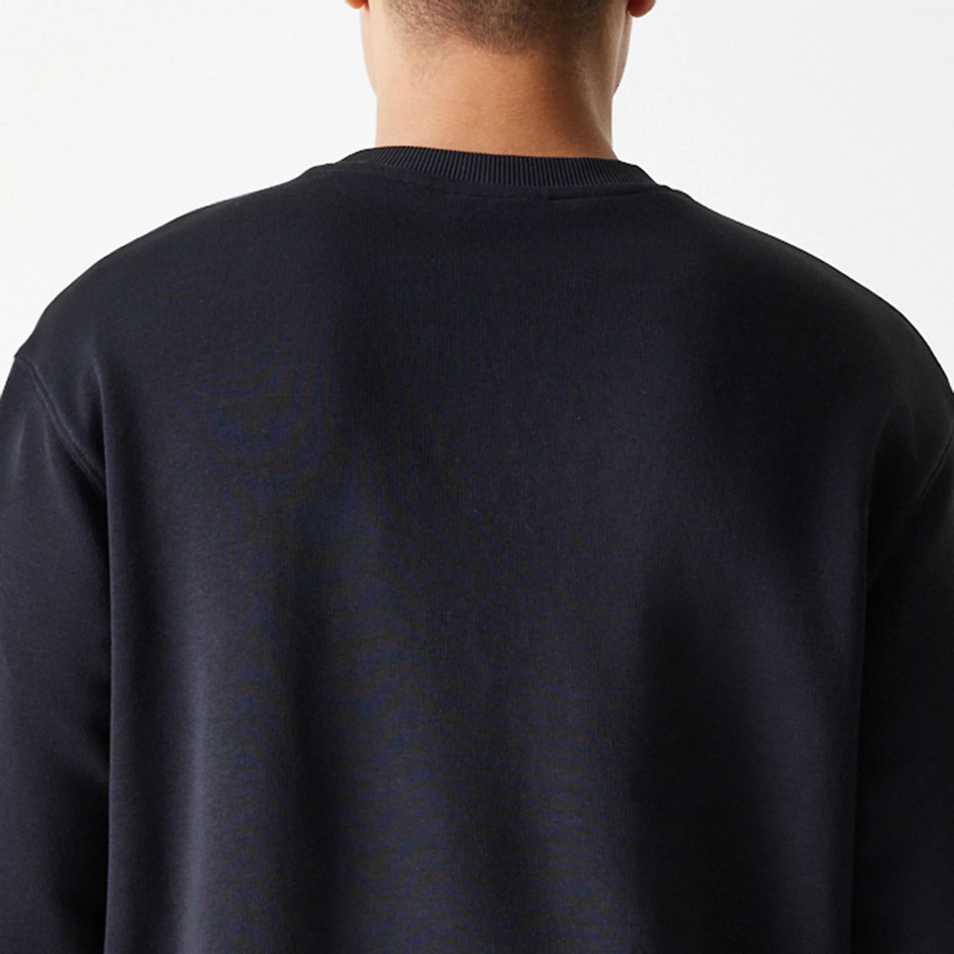 The Male model is wearing New York Yankees MLB League Essential Black Crew Neck Sweater 7