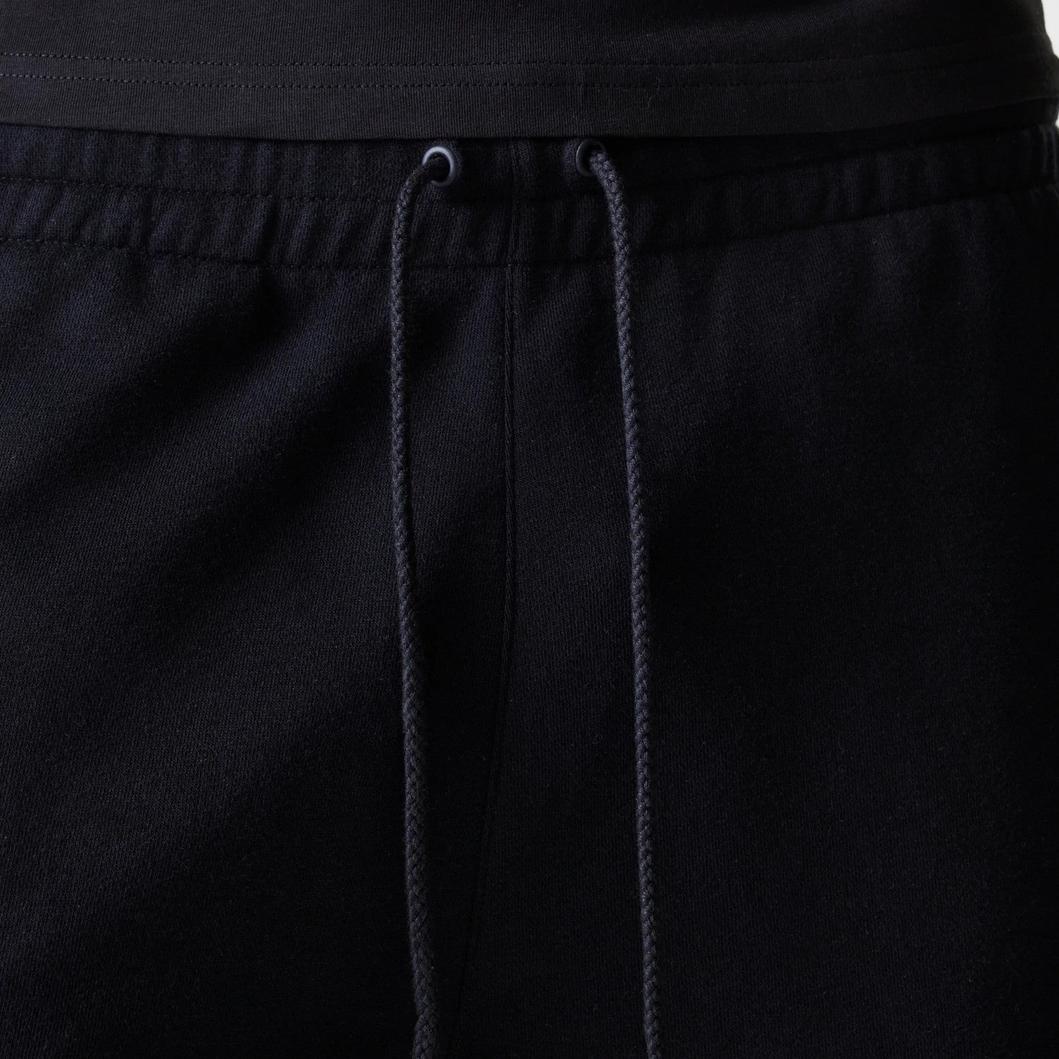 The Male model is wearing New York Yankees MLB League Essential Black Shorts 6