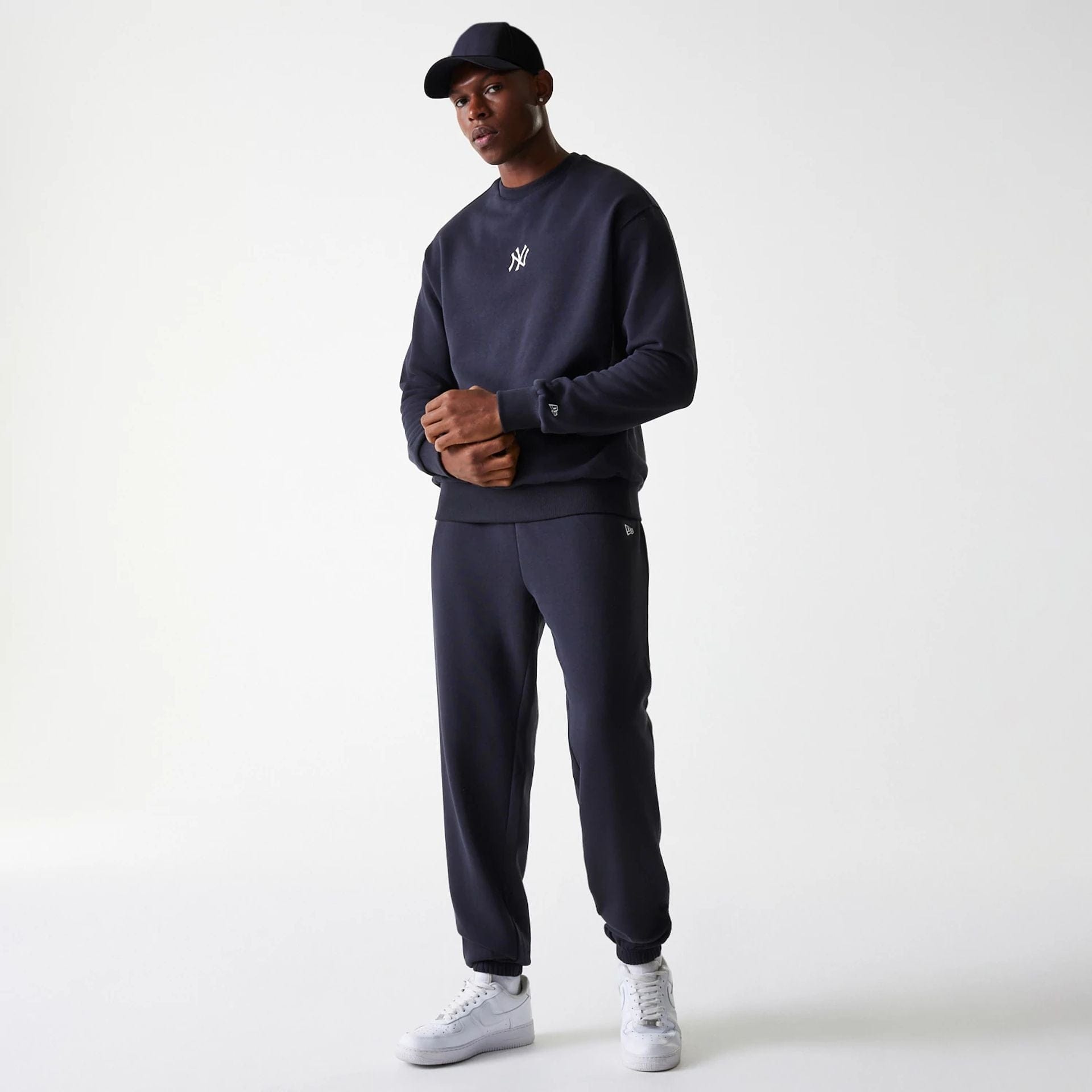 The Male model is wearing New York Yankees MLB League Essential Navy Crew Neck Sweater 8