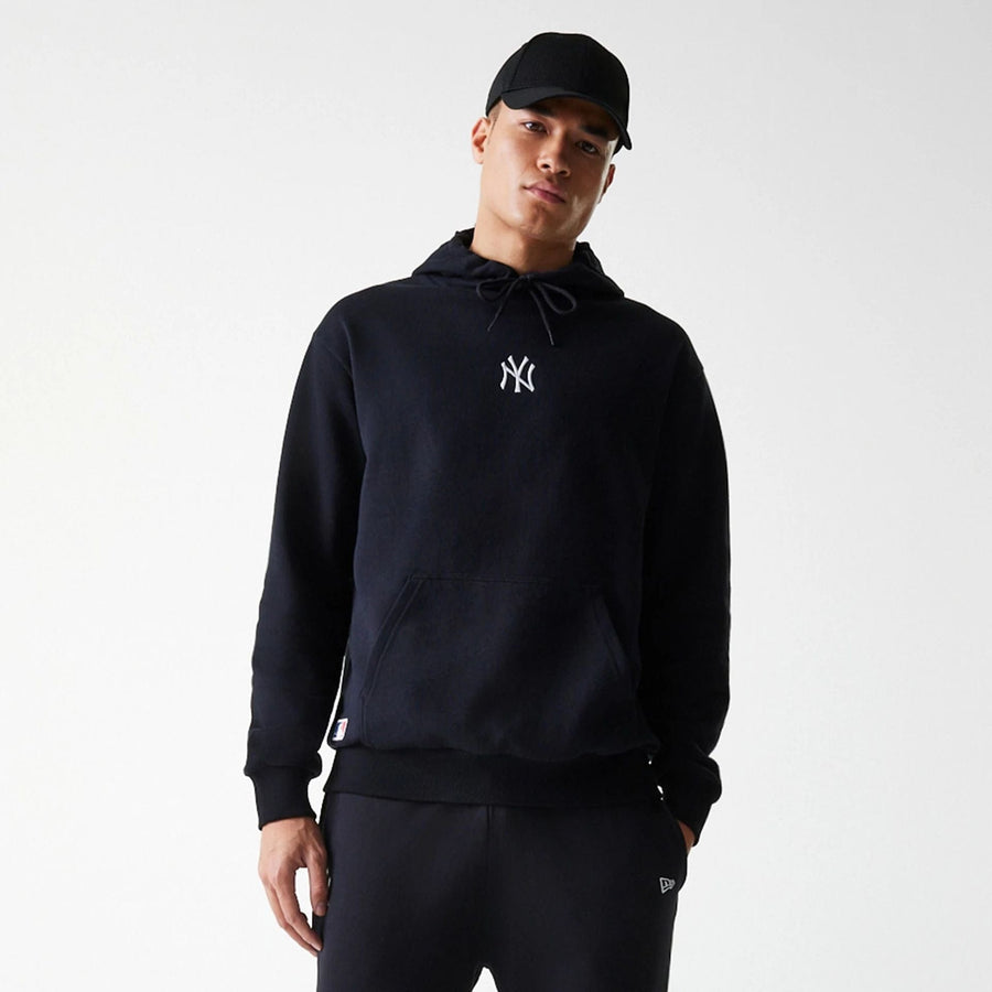 The Male model is wearing New York Yankees MLB League Essential Midi Black Oversized Pullover Hoodie 3