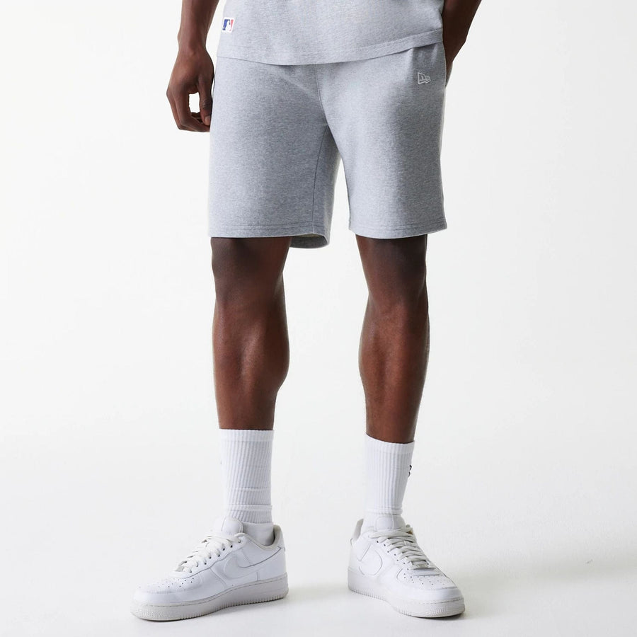 The Male model is wearing New York Yankees MLB League Essential Grey Shorts 1