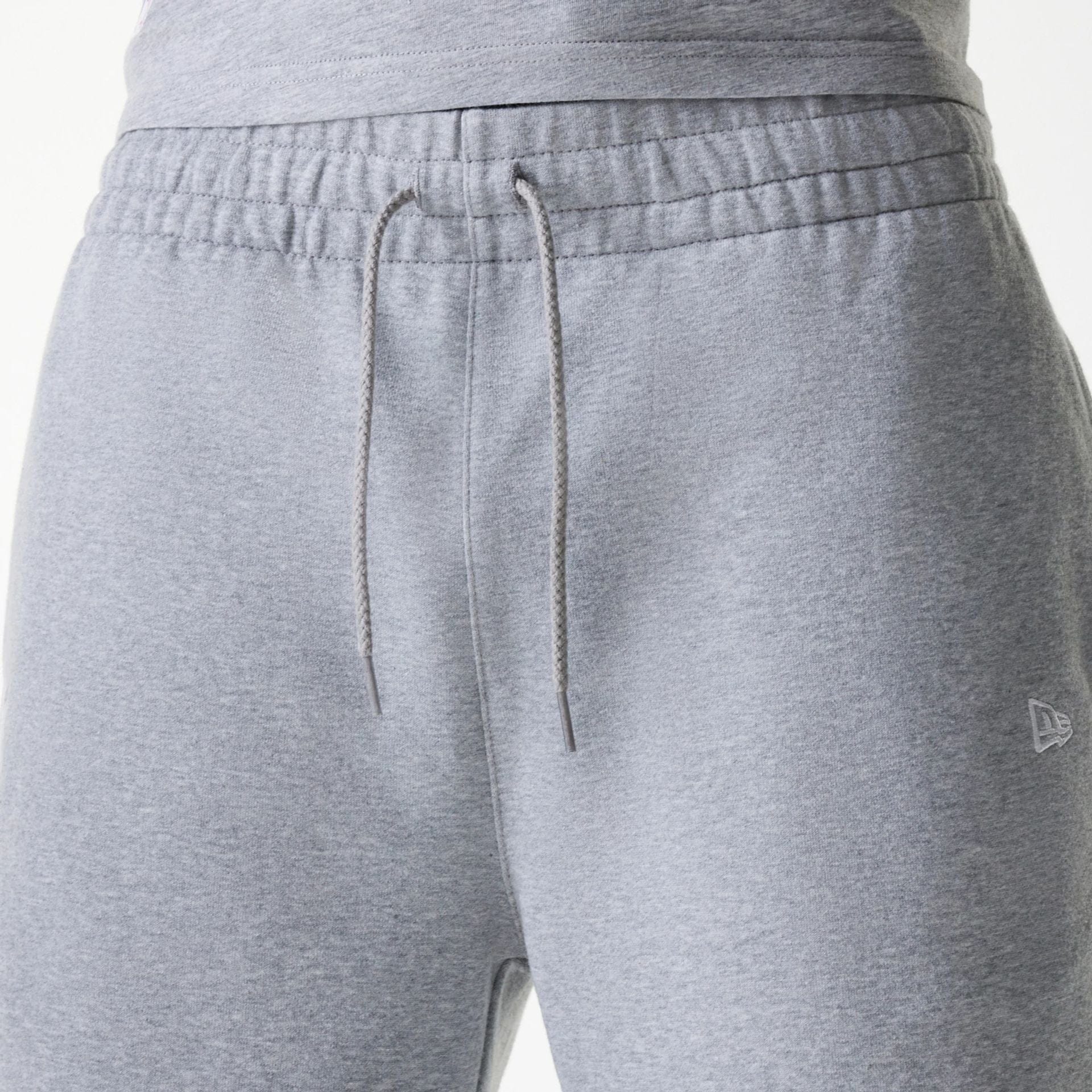 The Male model is wearing New York Yankees MLB League Essential Grey Shorts 6