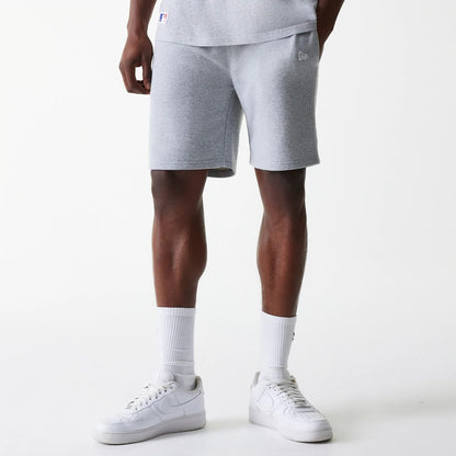 The Male model is wearing New York Yankees MLB League Essential Grey Shorts 1