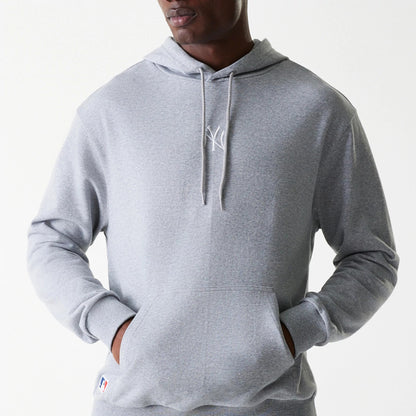 The Male model is wearing New York Yankees MLB League Essential Midi Grey Oversized Pullover Hoodie 3