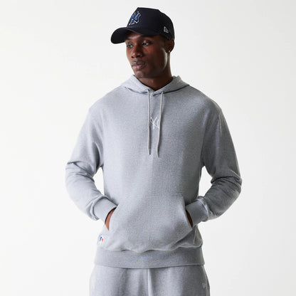 The Male model is wearing New York Yankees MLB League Essential Midi Grey Oversized Pullover Hoodie 1