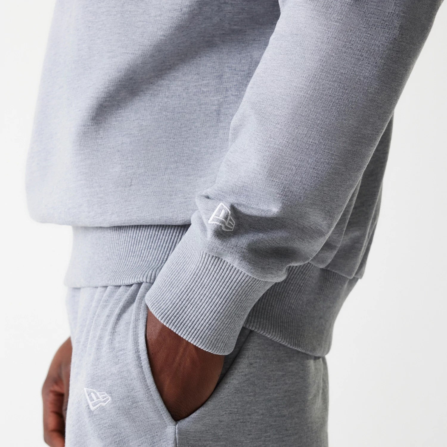 The Male model is wearing New York Yankees MLB League Essential Grey Crew Neck Sweater. 5