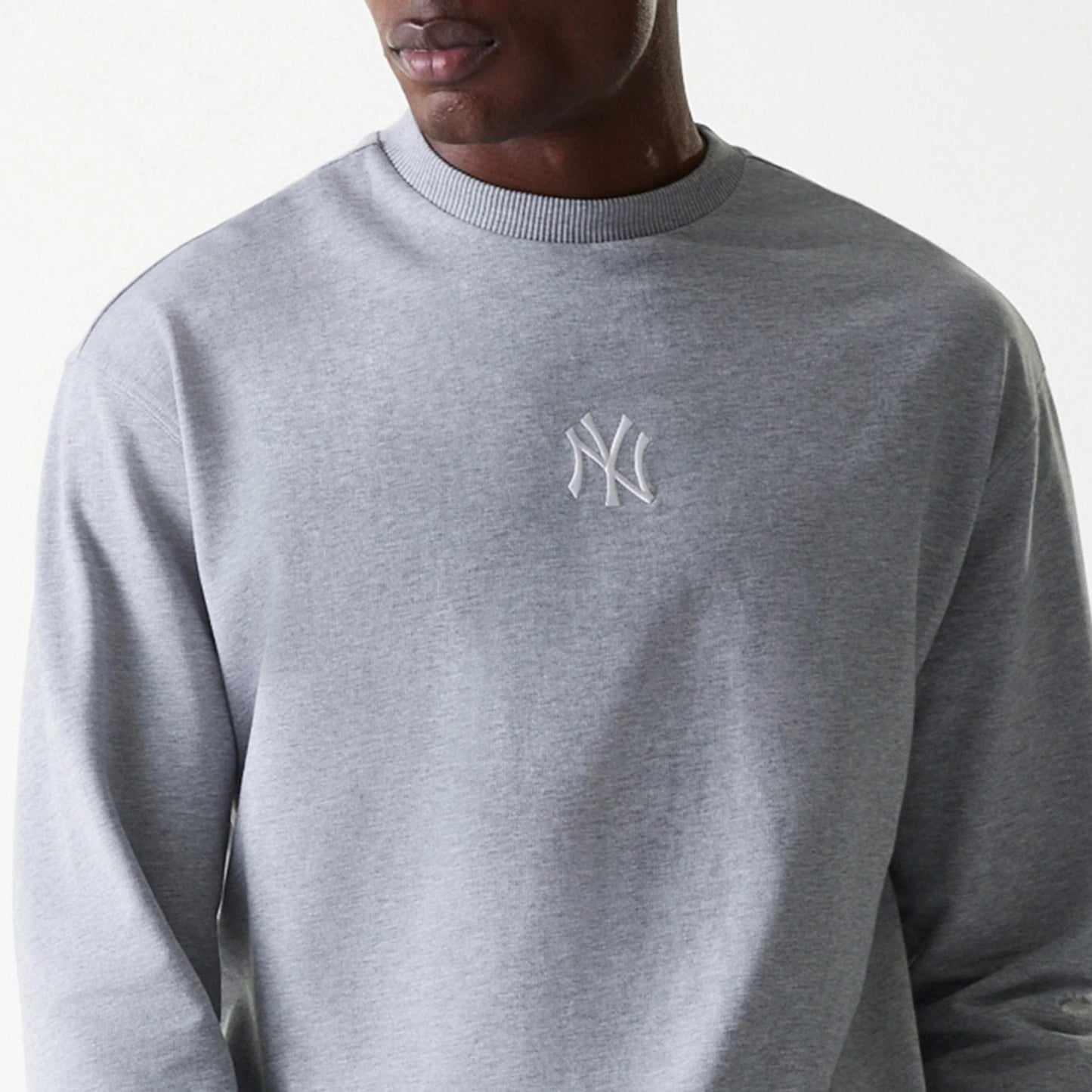 The Male model is wearing New York Yankees MLB League Essential Grey Crew Neck Sweater 6