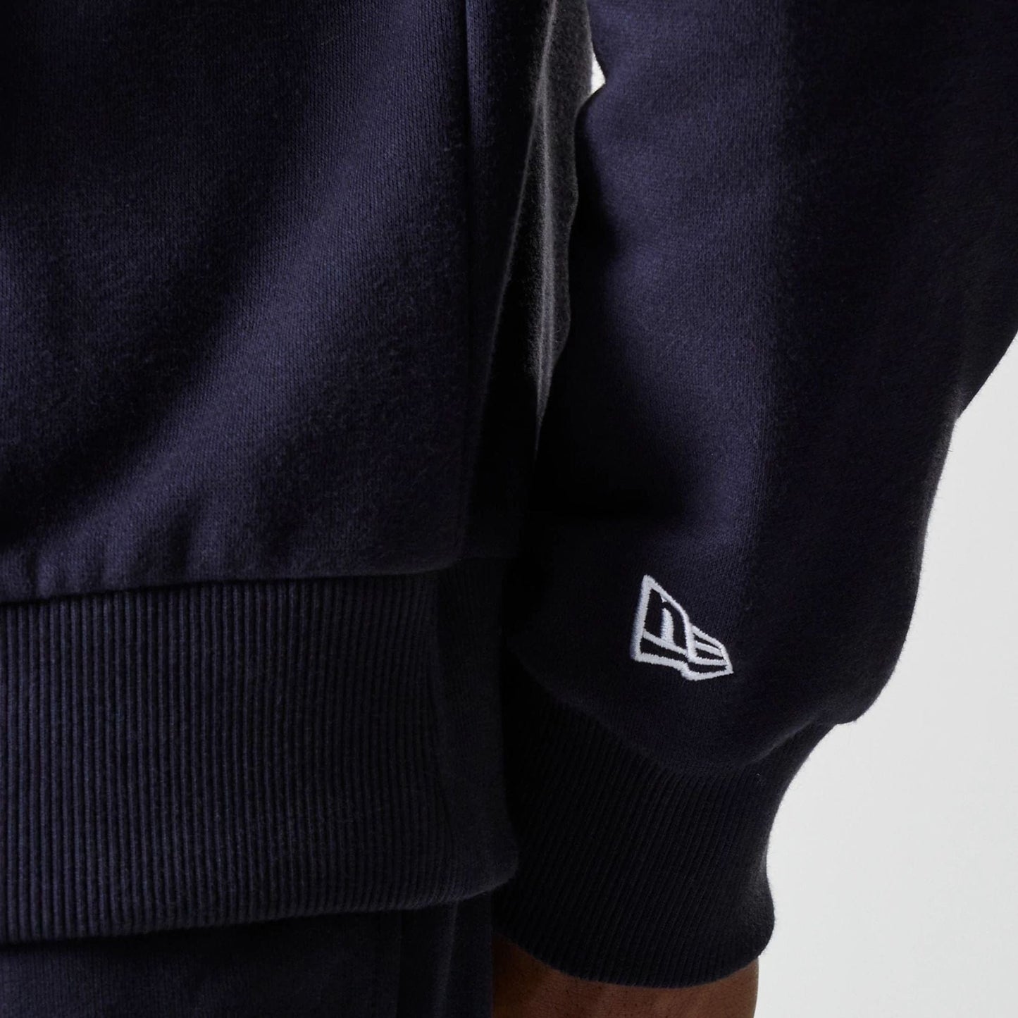 The Male model is wearing New York Yankees MLB League Essential Midi Navy Oversized Pullover Hoodie 5