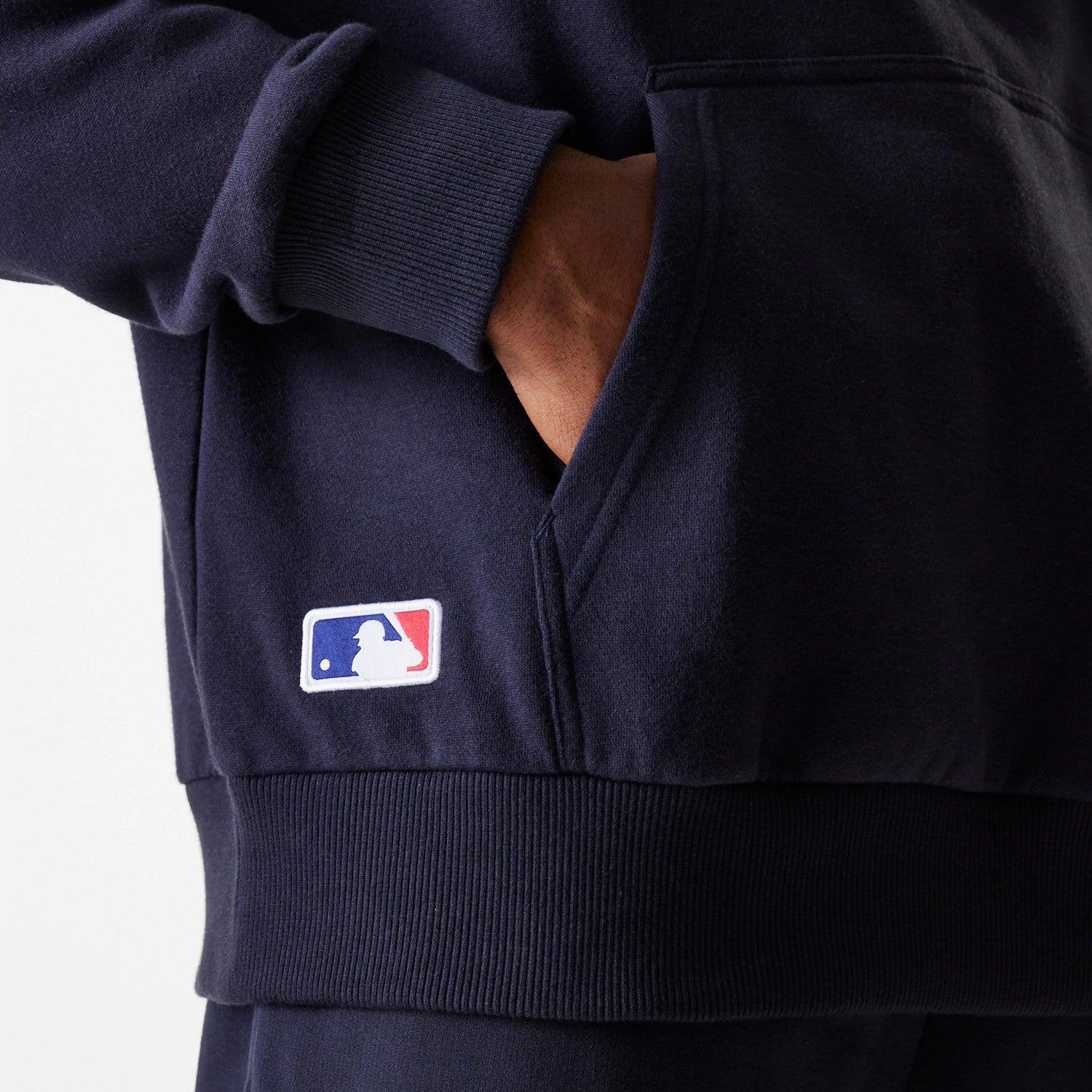 The Male model is wearing New York Yankees MLB League Essential Midi Navy Oversized Pullover Hoodie 6
