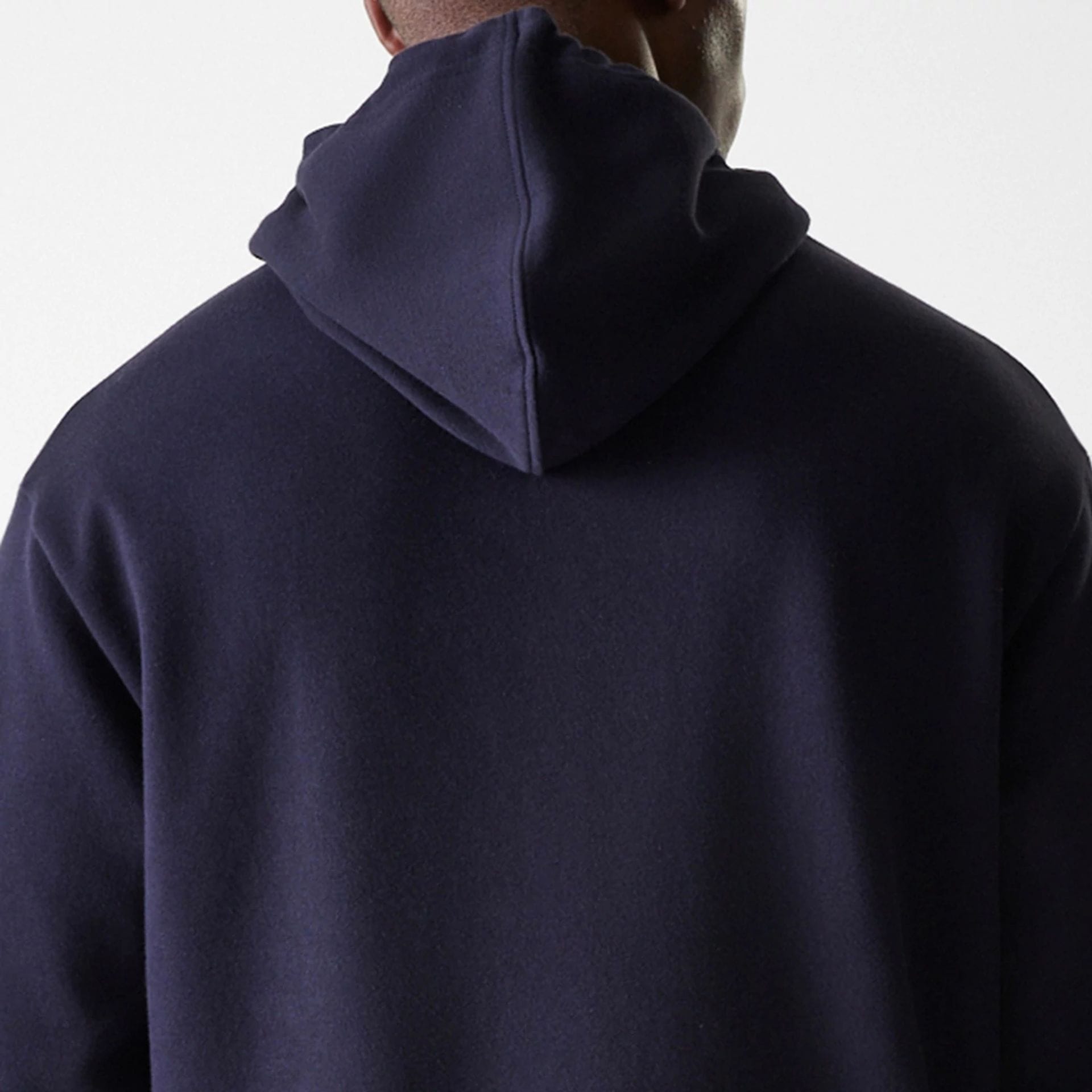 The Male model is wearing New York Yankees MLB League Essential Midi Navy Oversized Pullover Hoodie 7