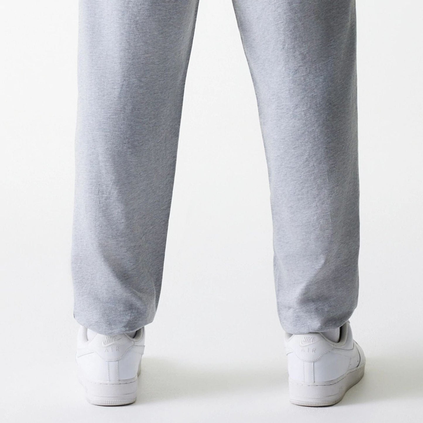 The Male model is wearing New York Yankees MLB League Essential Midi Grey Joggers 7