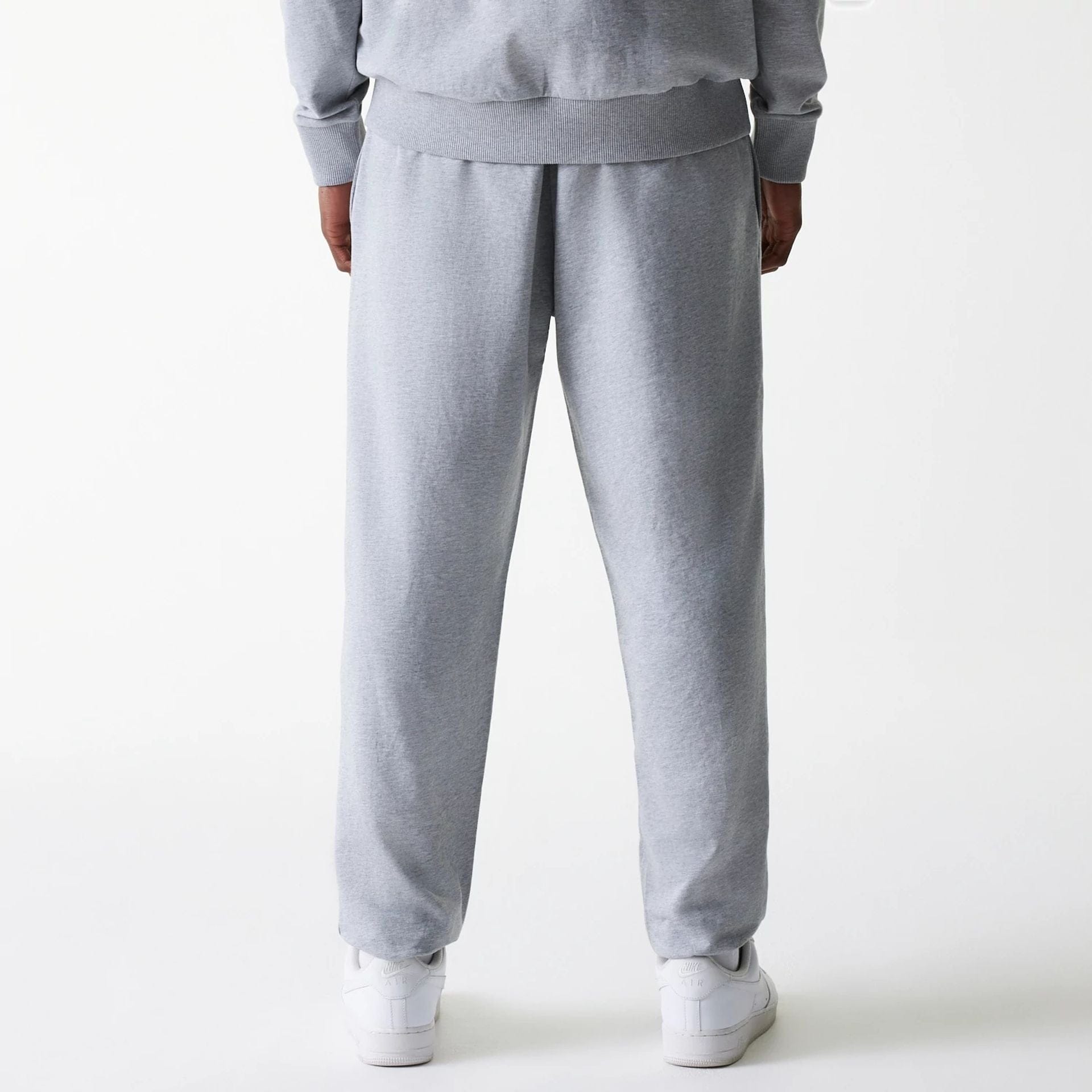 The Male model is wearing New York Yankees MLB League Essential Midi Grey Joggers 2