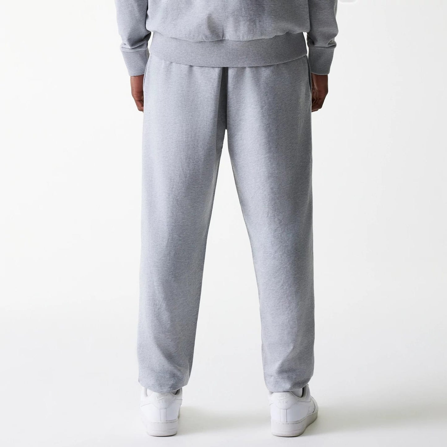 The Male model is wearing New York Yankees MLB League Essential Midi Grey Joggers 2