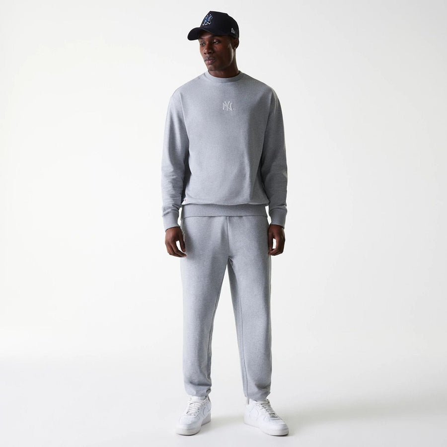 The Male model is wearing New York Yankees MLB League Essential Midi Grey Joggers 8