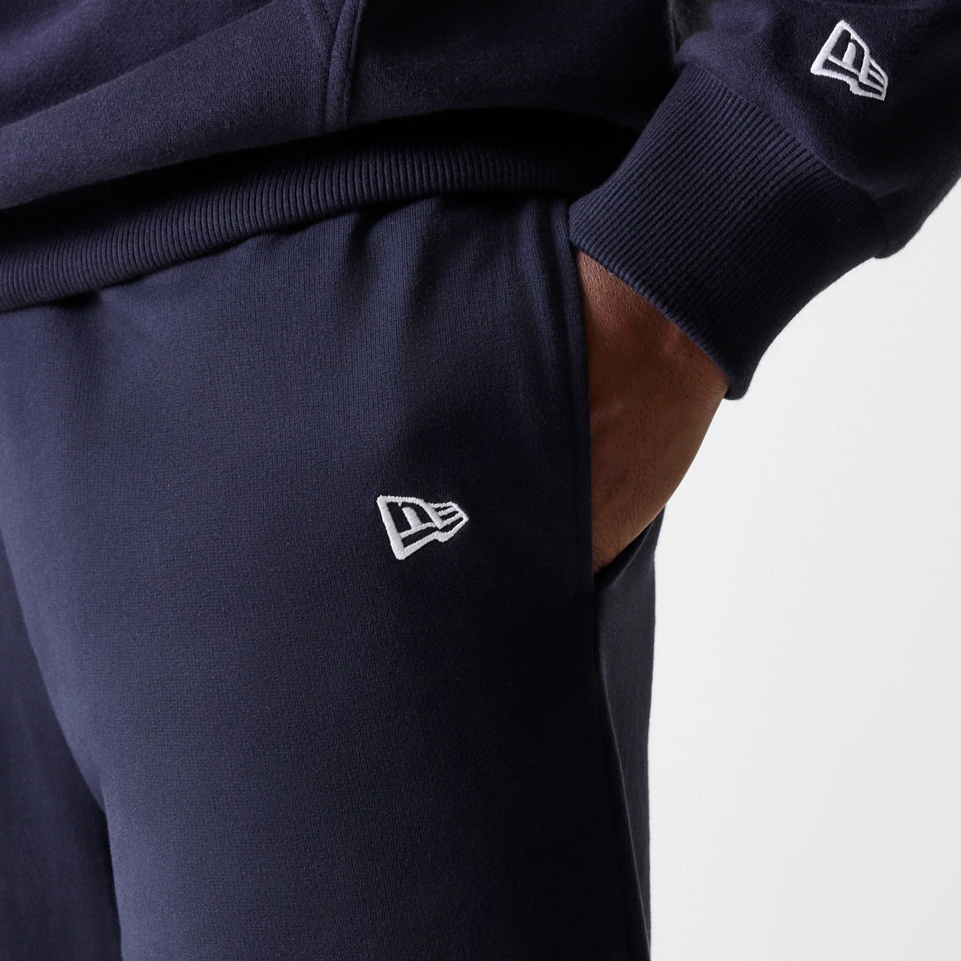 The Male model is wearing New York Yankees MLB League Essential Midi Navy Joggers 5