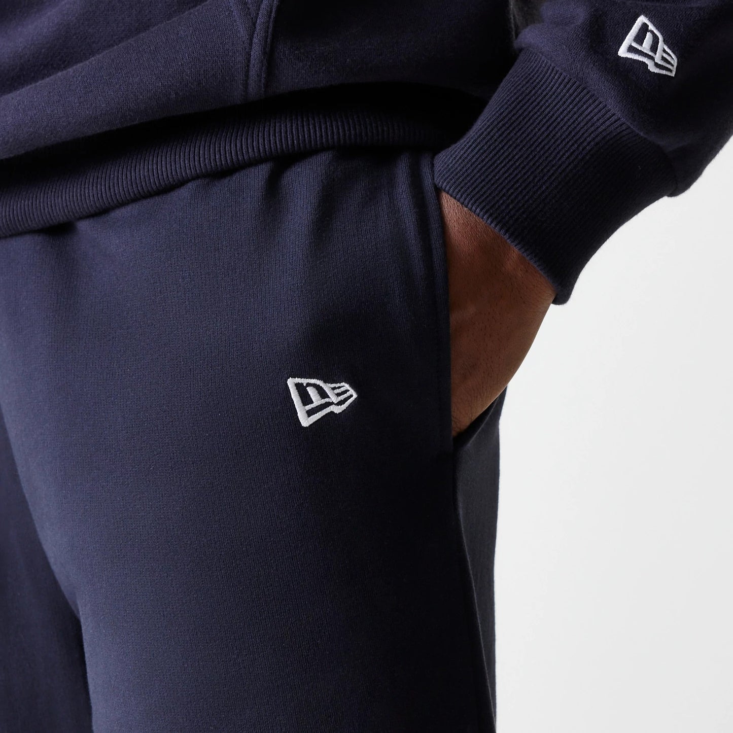 The Male model is wearing New York Yankees MLB League Essential Midi Navy Joggers 5