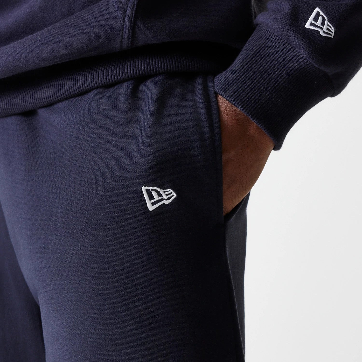 The Male model is wearing New York Yankees MLB League Essential Midi Navy Joggers 5