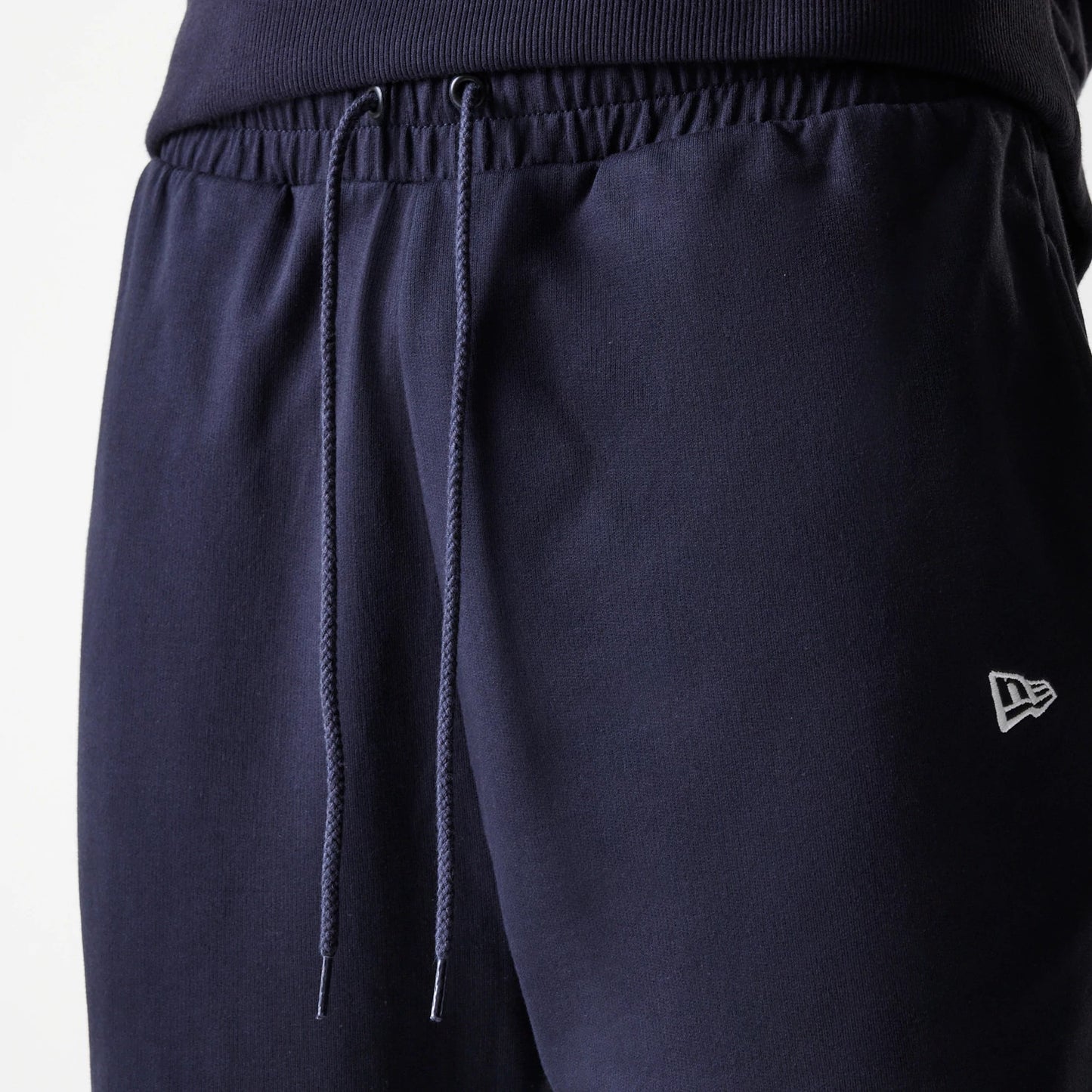 The Male model is wearing New York Yankees MLB League Essential Midi Navy Joggers 6