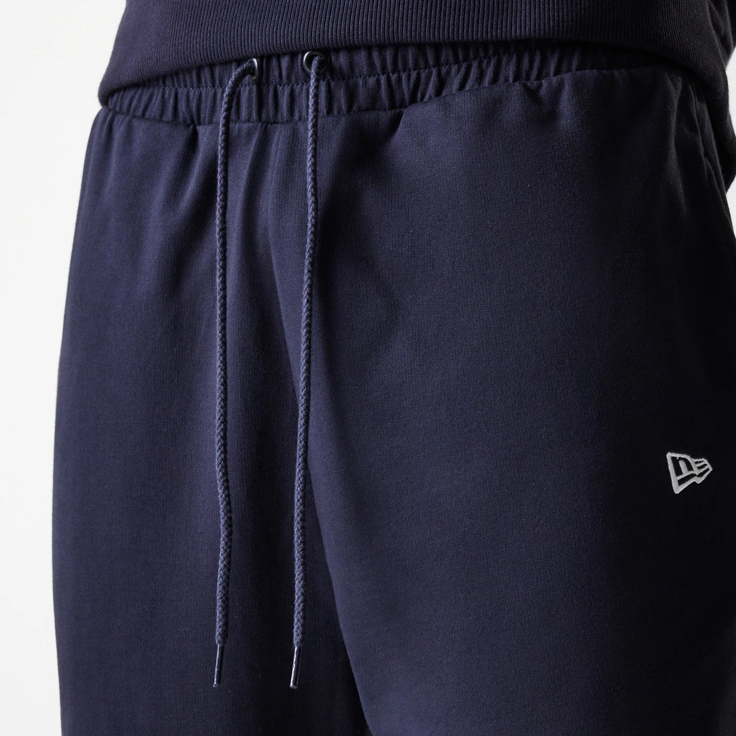 The Male model is wearing New York Yankees MLB League Essential Midi Navy Joggers 6