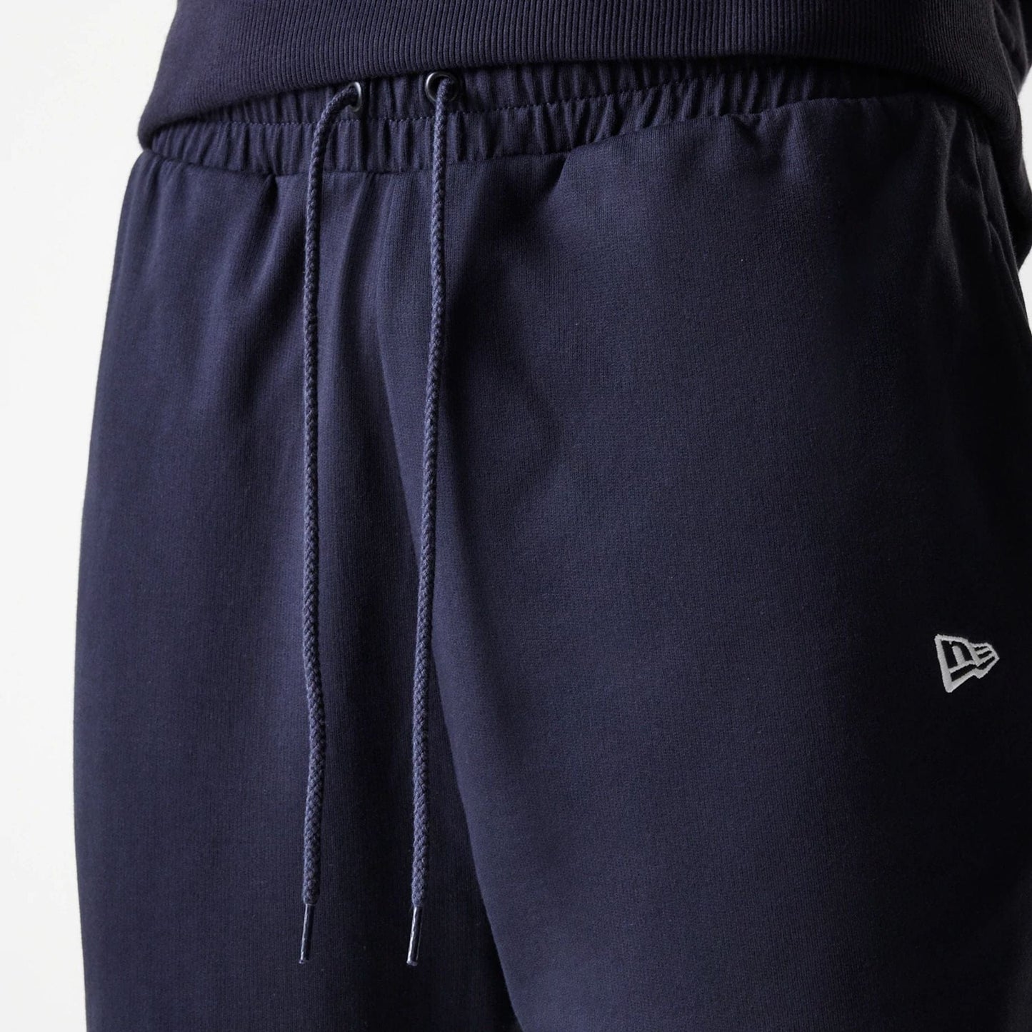 The Male model is wearing New York Yankees MLB League Essential Midi Navy Joggers 6