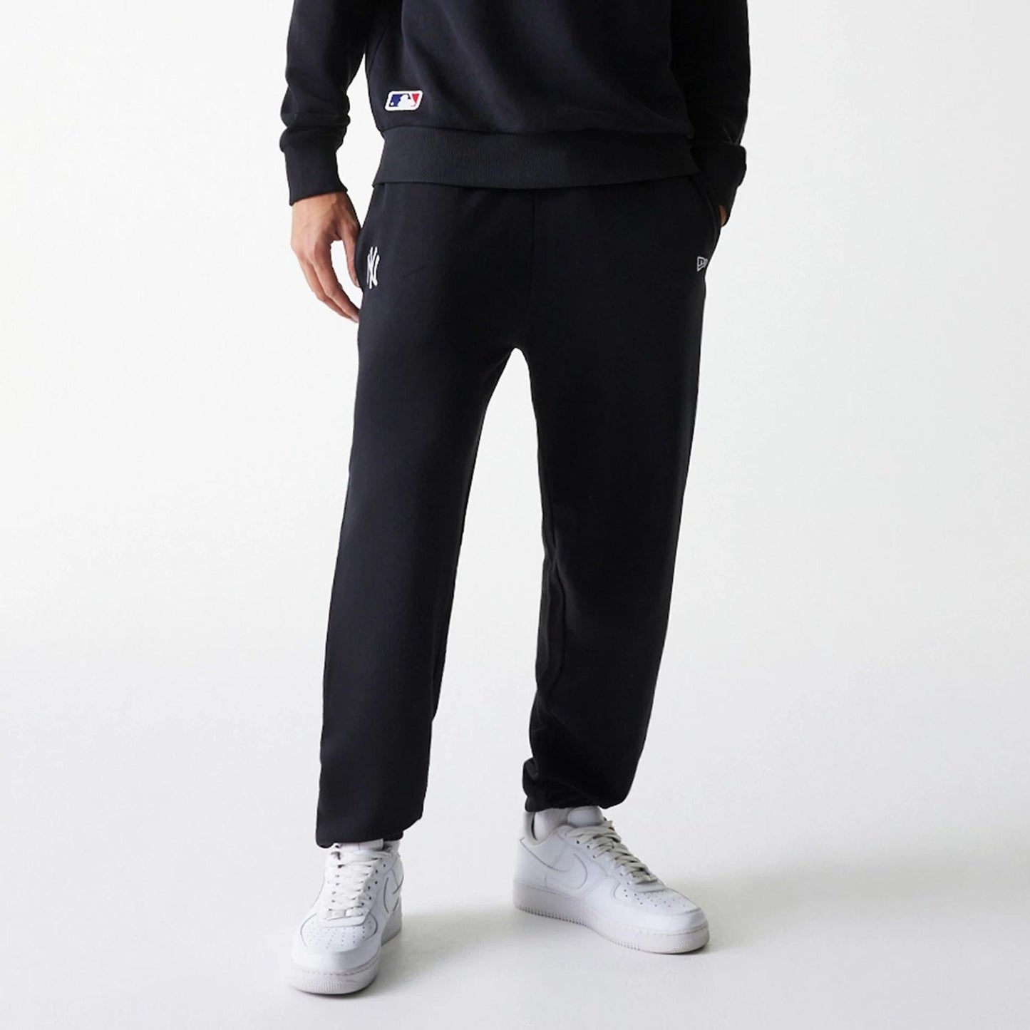 The Male model is wearing New York Yankees MLB League Essential Black Joggers 3