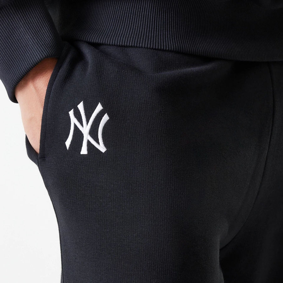 The Male model is wearing New York Yankees MLB League Essential Black Joggers 4