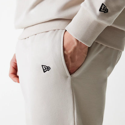 The Male model is wearing New York Yankees MLB League Essential Midi Cream Joggers 5