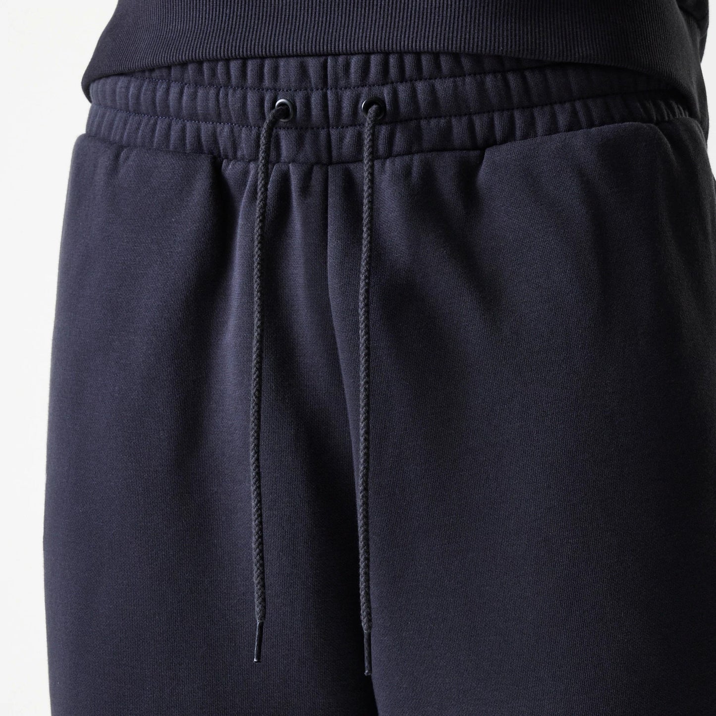 The Male model is wearing New York Yankees MLB League Essential Navy Joggers 6
