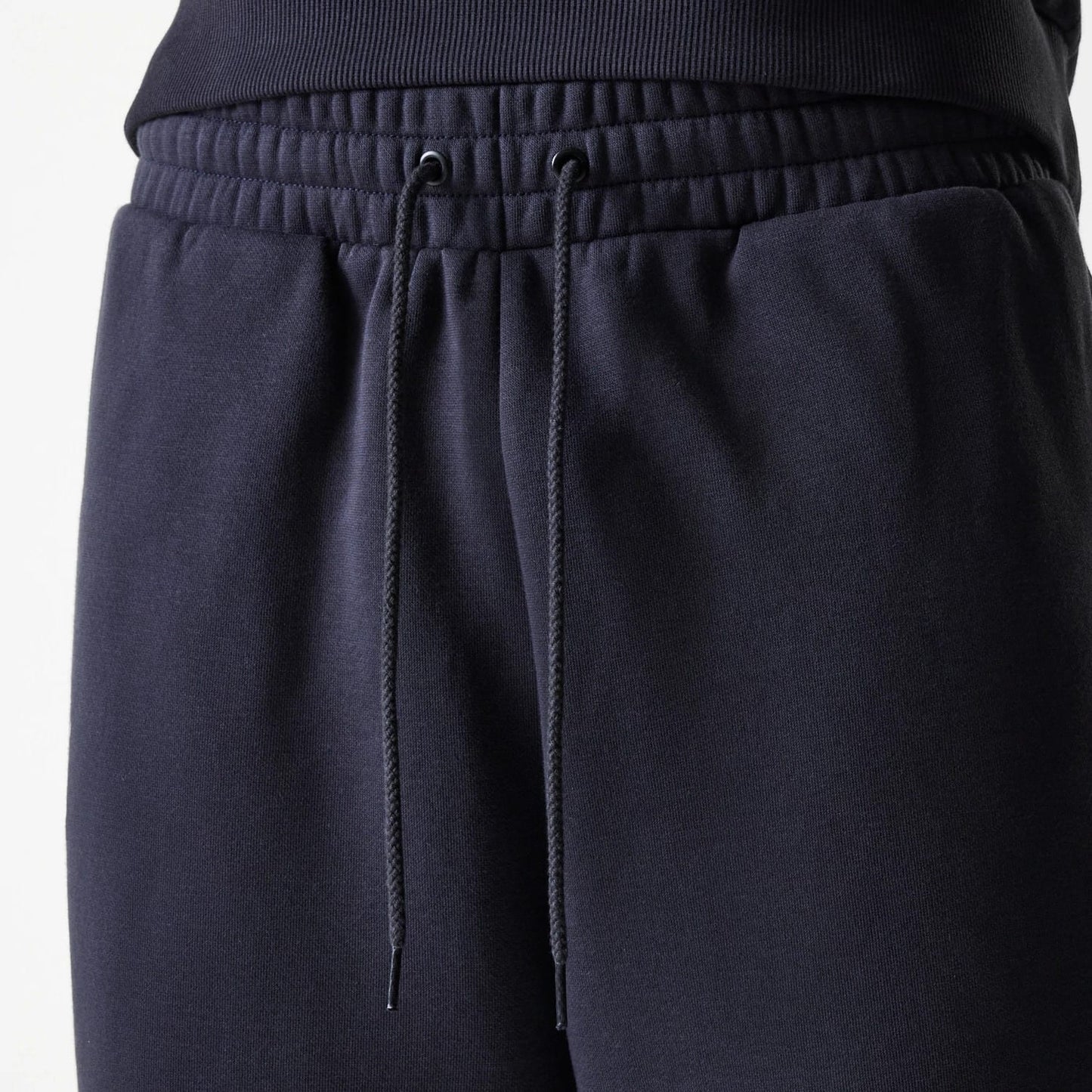 The Male model is wearing New York Yankees MLB League Essential Navy Joggers 6