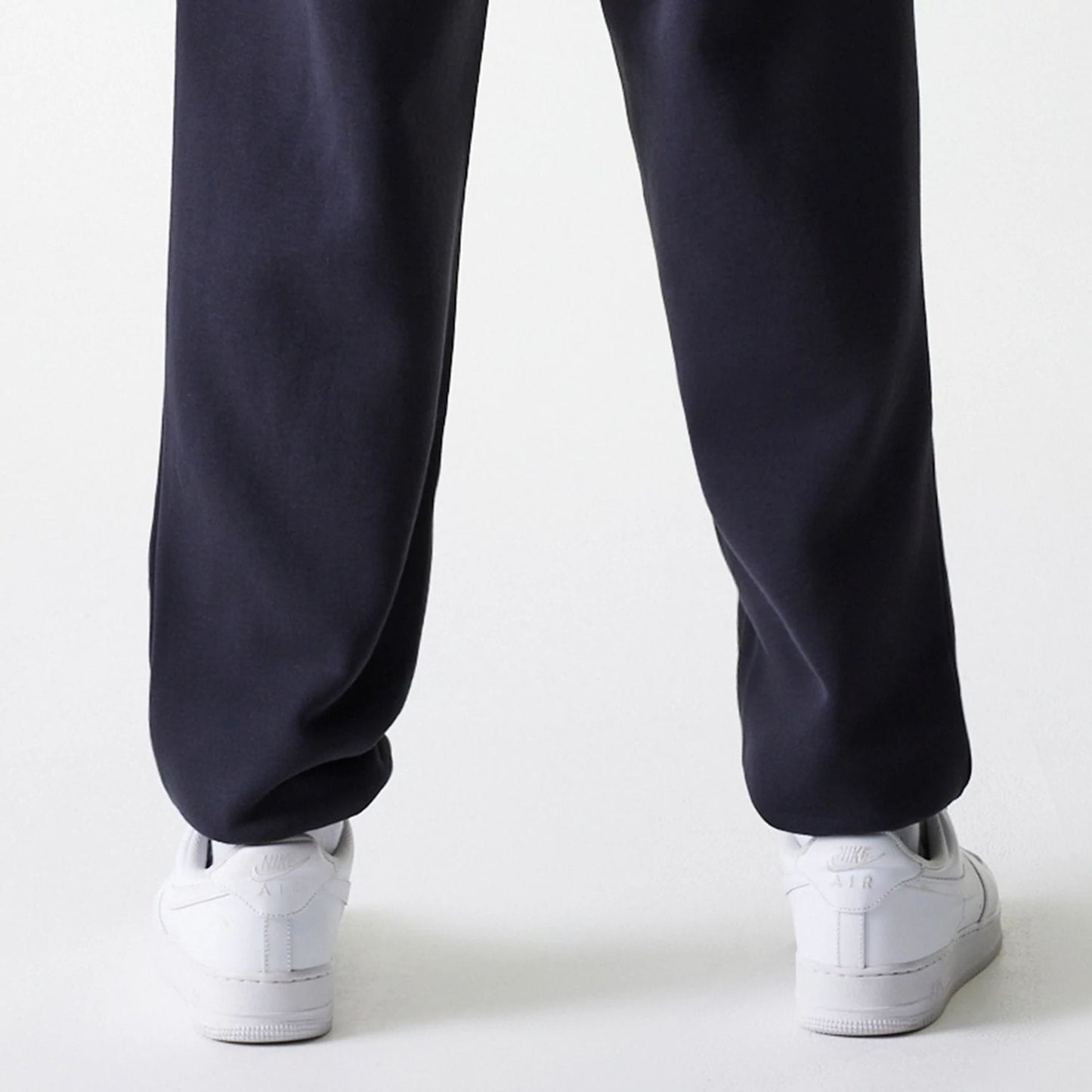 The Male model is wearing New York Yankees MLB League Essential Navy Joggers 7