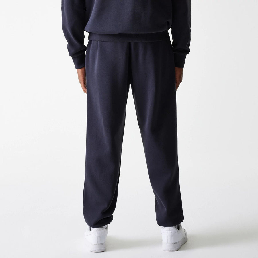 The Male model is wearing New York Yankees MLB League Essential Navy Joggers 2