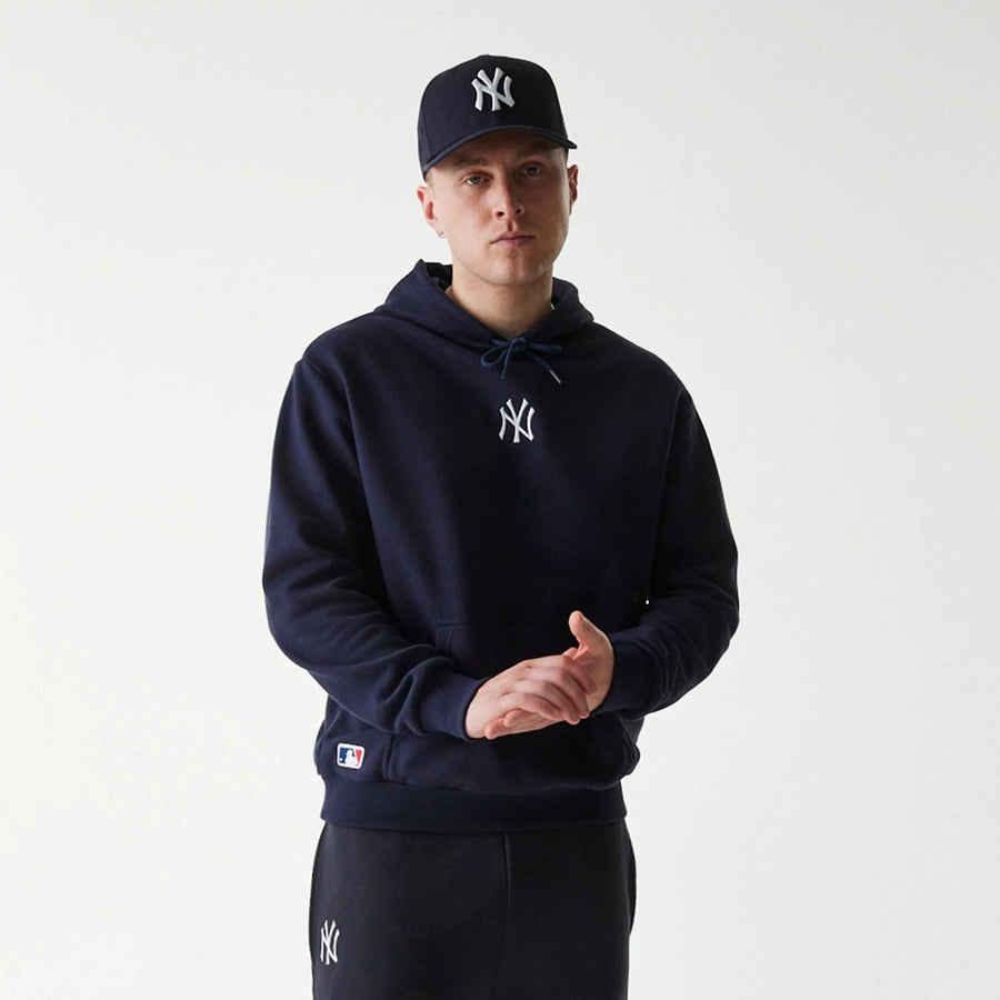 The Male model is wearing New York Yankees MLB League Essential Navy Oversized Pullover Hoodie 3