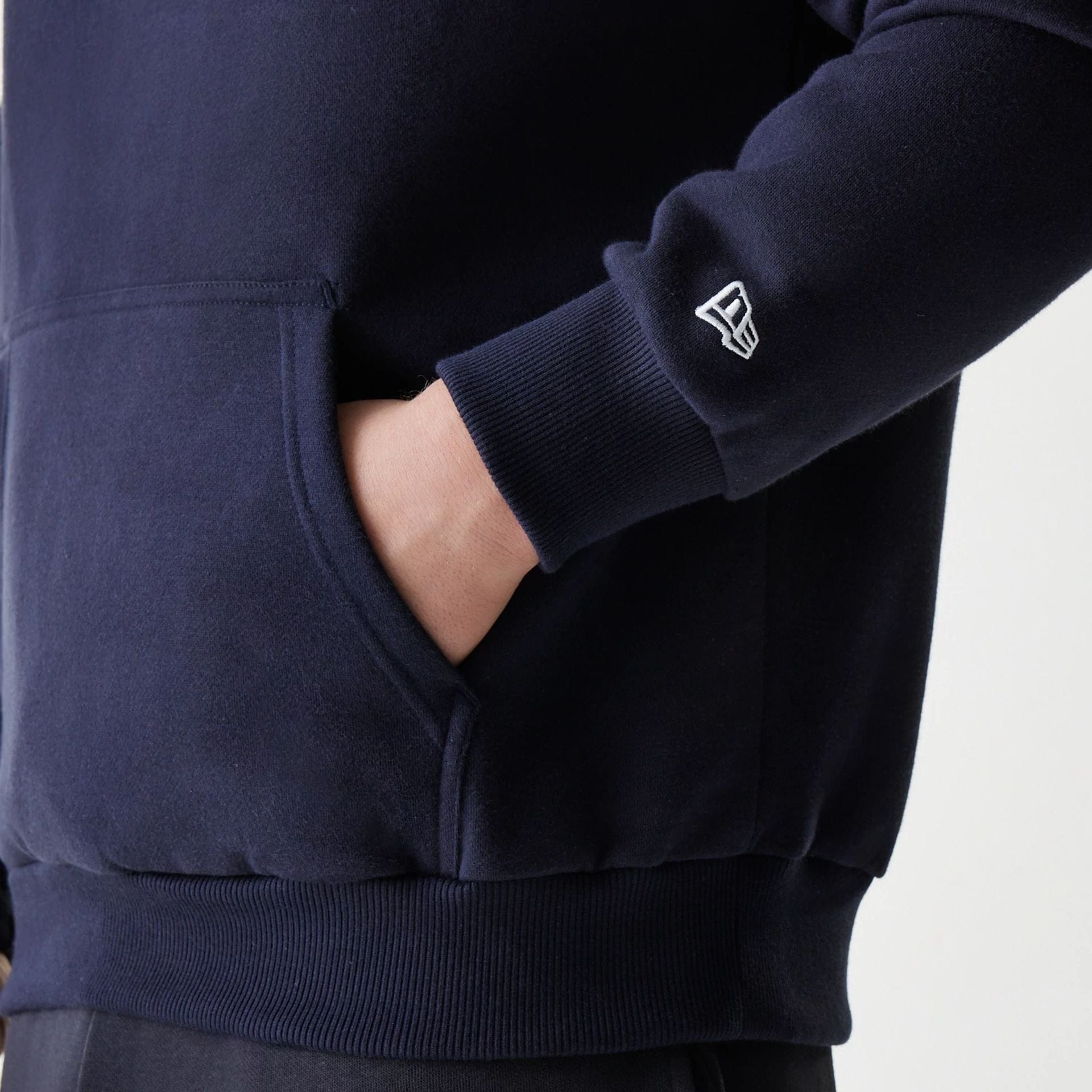 The Male model is wearing New York Yankees MLB League Essential Navy Oversized Pullover Hoodie 7