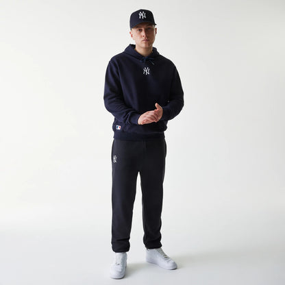 The Male model is wearing New York Yankees MLB League Essential Navy Oversized Pullover Hoodie 8