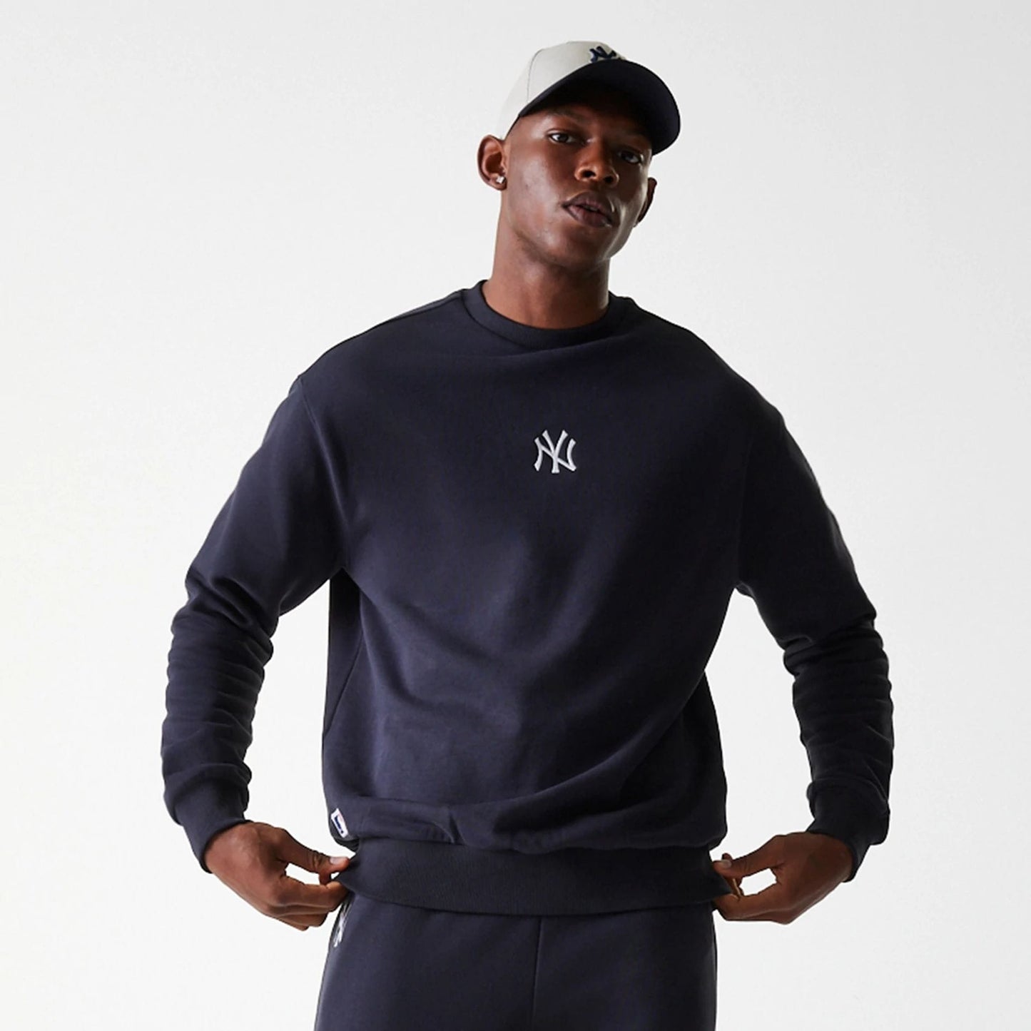 The Male model is wearing New York Yankees MLB League Essential Midi Navy Oversized Crew Neck Sweater 3