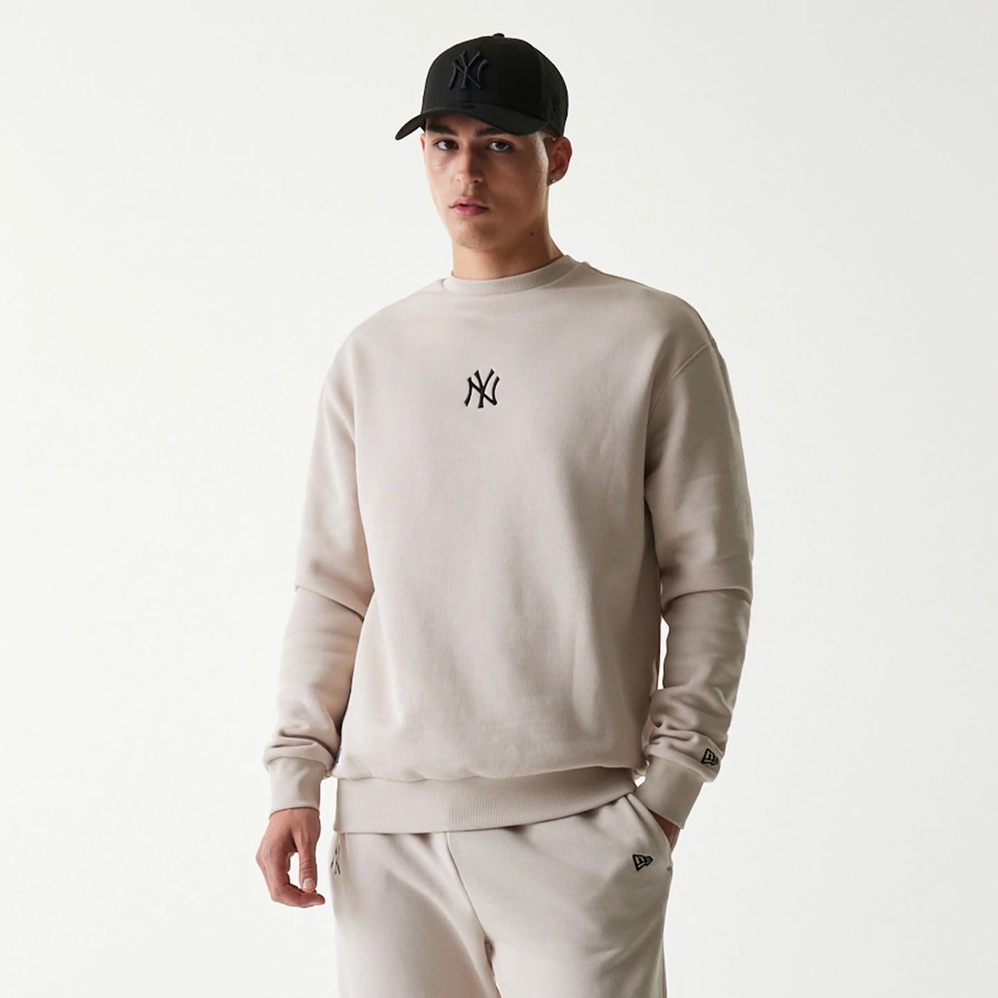 The Male model is wearing New York Yankees MLB League Essential Midi Cream Oversized Crew Neck Sweater 3