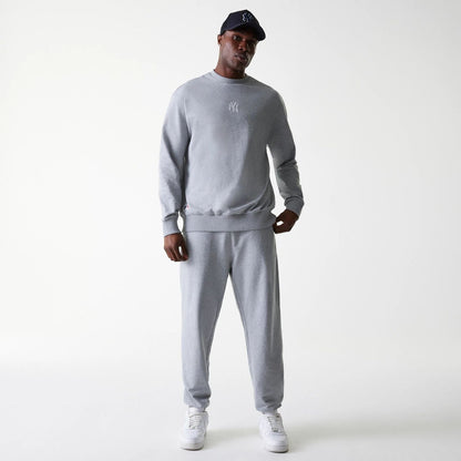 The Male model is wearing New York Yankees MLB League Essential Midi Grey Oversized Crew Neck Sweater 7