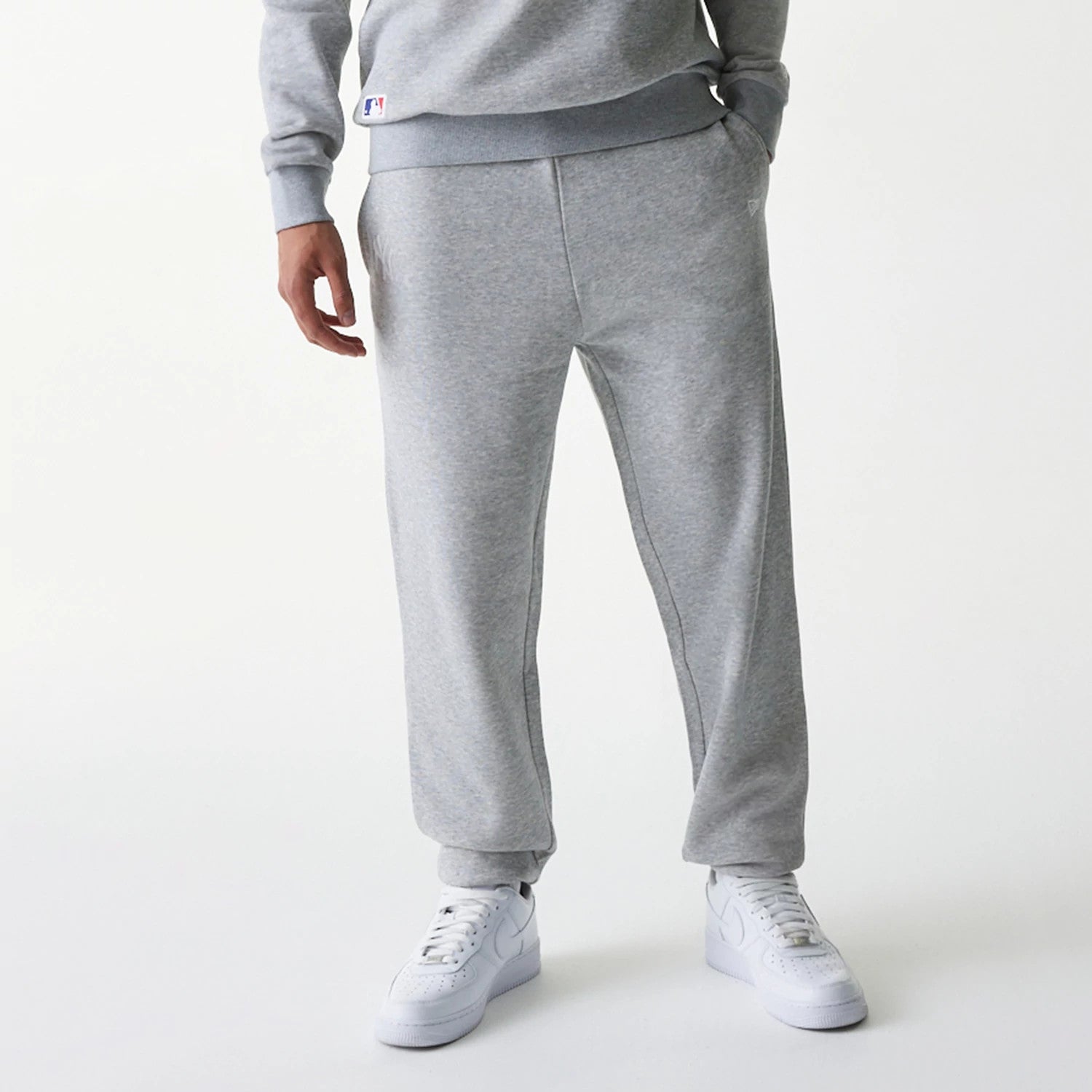 The Male model is wearing New York Yankees MLB League Essential Grey Joggers 6