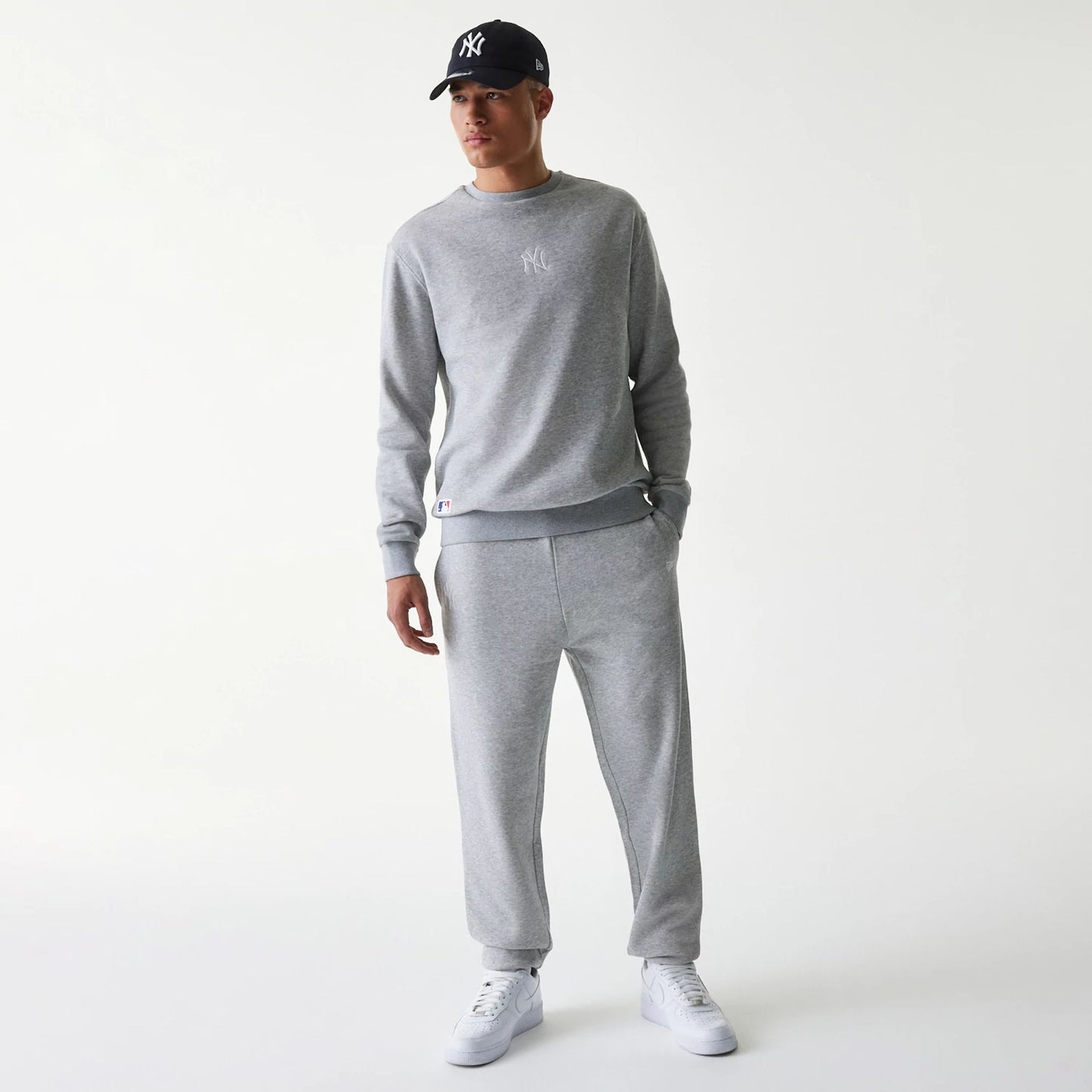 The Male model is wearing New York Yankees MLB League Essential Grey Joggers 8