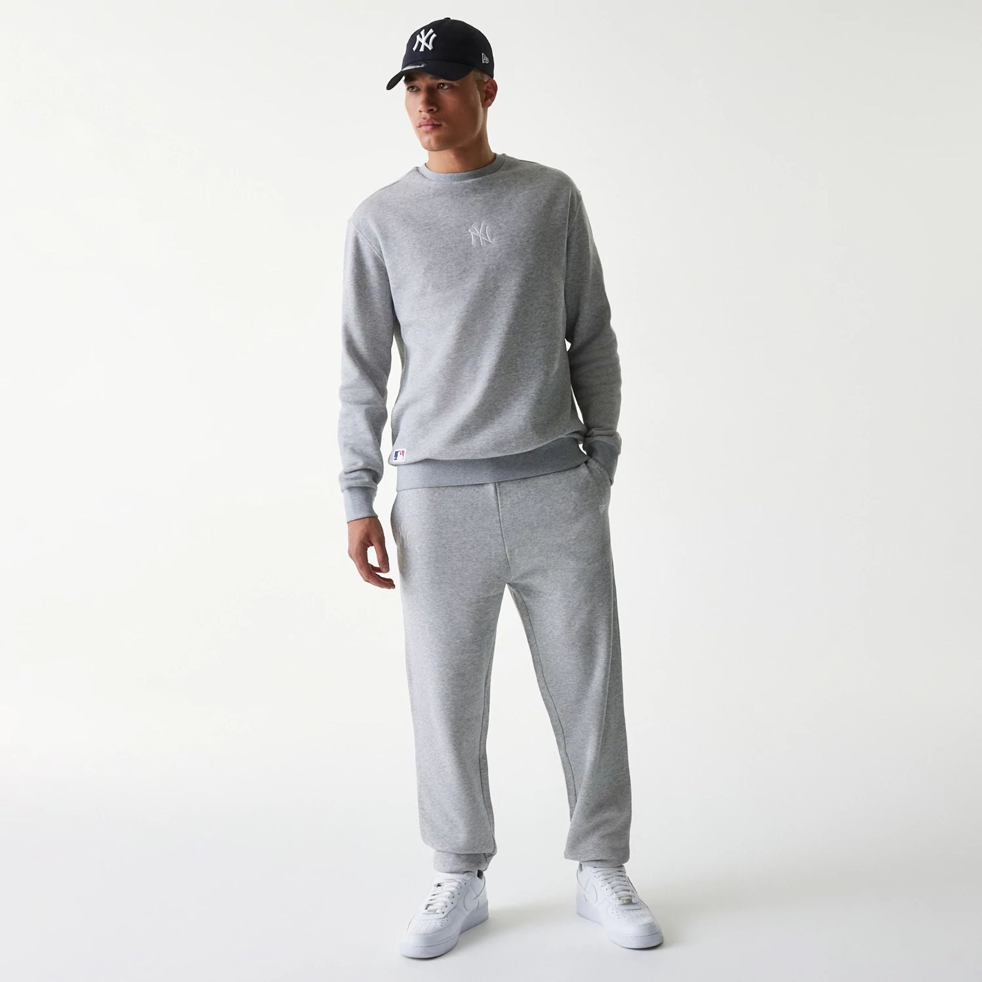 The Male model is wearing New York Yankees MLB League Essential Grey Joggers 8