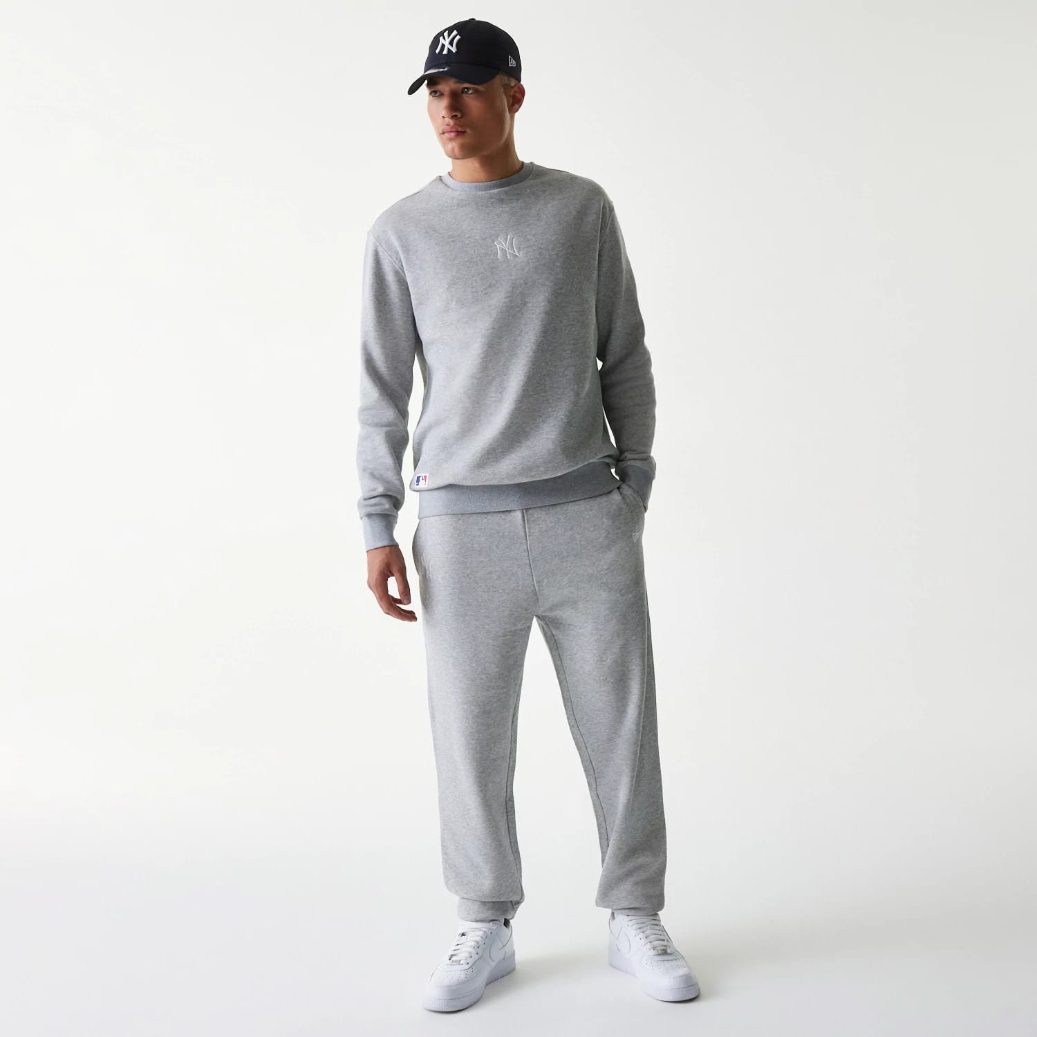 The Male model is wearing New York Yankees MLB League Essential Grey Joggers 8