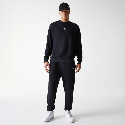 The Male model is wearing New York Yankees MLB League Essential Midi Black Oversized Crew Neck Sweater 7