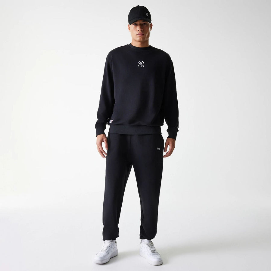 The Male model is wearing New York Yankees MLB League Essential Midi Black Oversized Crew Neck Sweater 7