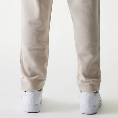 The Male model is wearing New York Yankees MLB League Essential Cream Joggers 7