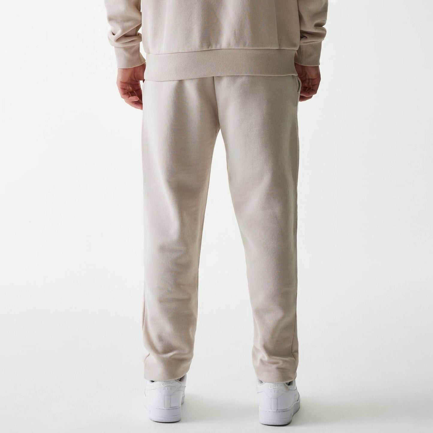 The Male model is wearing New York Yankees MLB League Essential Cream Joggers 2