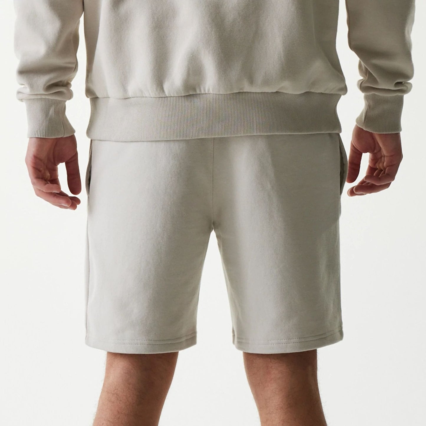 The Male model is wearing New York Yankees MLB League Essential Midi Cream Shorts 7
