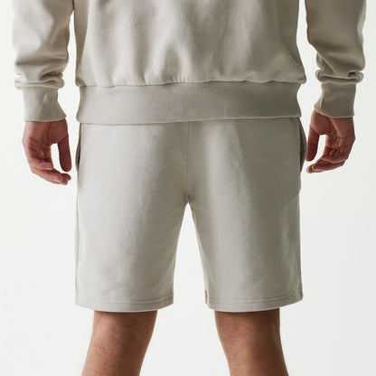 The Male model is wearing New York Yankees MLB League Essential Midi Cream Shorts 7