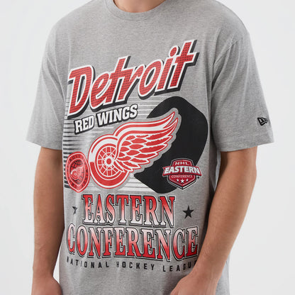 New Era Detroit Red Wings NHL Sport Classic Grey T-Shirt, front view showing large red and white graphics with the team's logo and text on the grey fabric, a small black raised New Era logo on the left sleeve.
